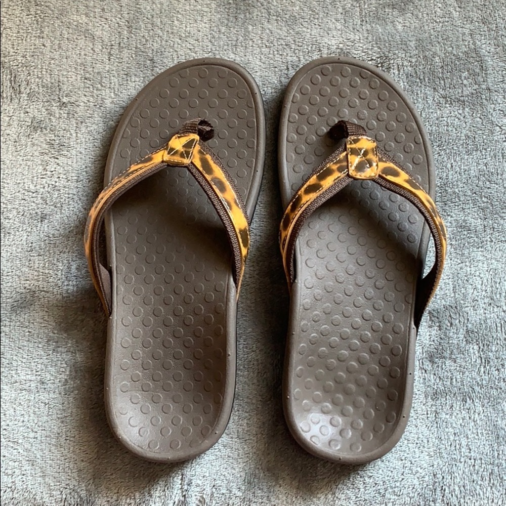 Brown leopard print flip flops